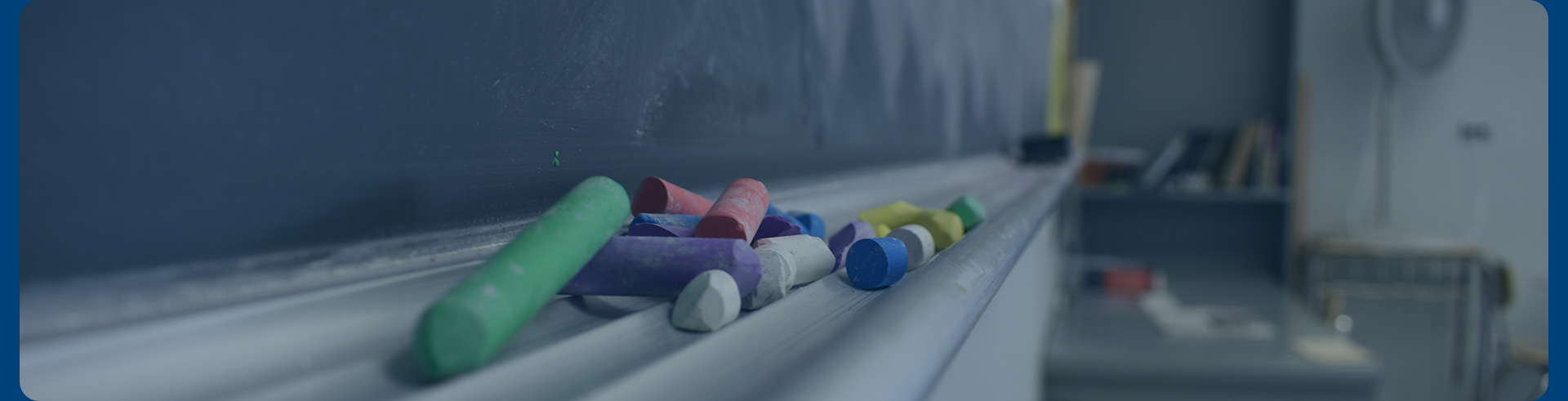 Artistic photo of chalk and a chalkboard